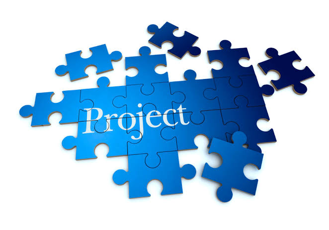 Puzzle pieces, with a title Project written over them